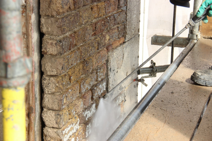 Brick cleaning underway using low pressure water application